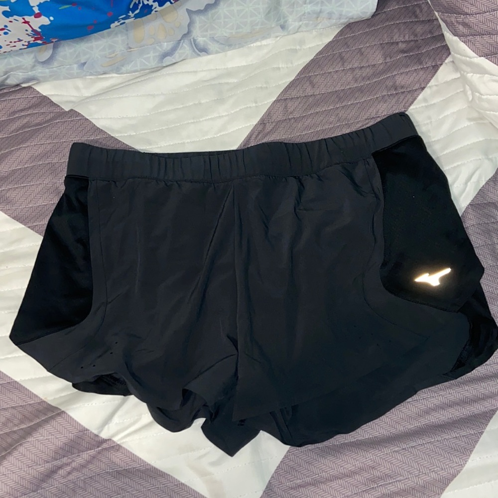 dark grey and black mizuno athletic shorts